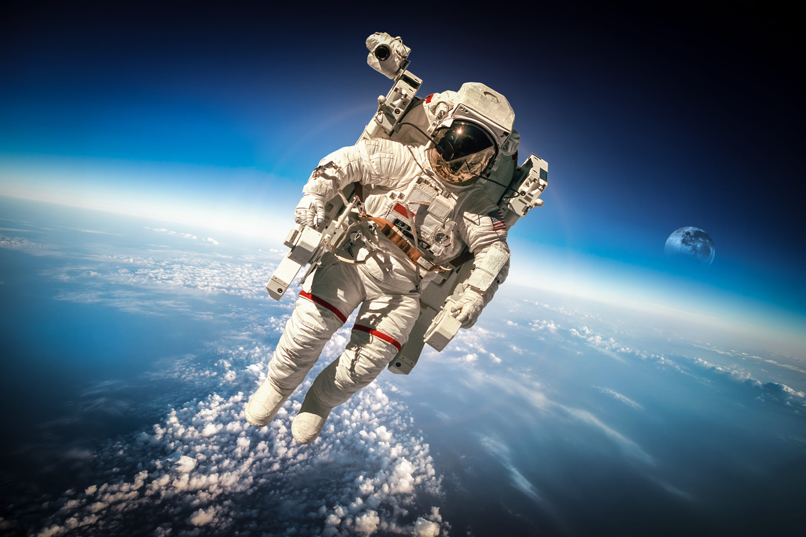 Astronaut in outer space against the backdrop of the planet earth.